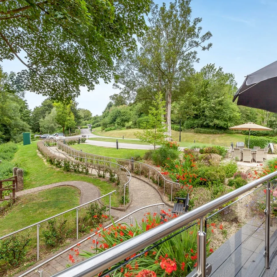 Lodge decking overlooking Newton Brook at Bath Mill