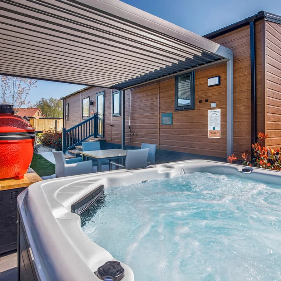 Luxury lodge exterior with hot tub at Yorkshire Spa Retreat
